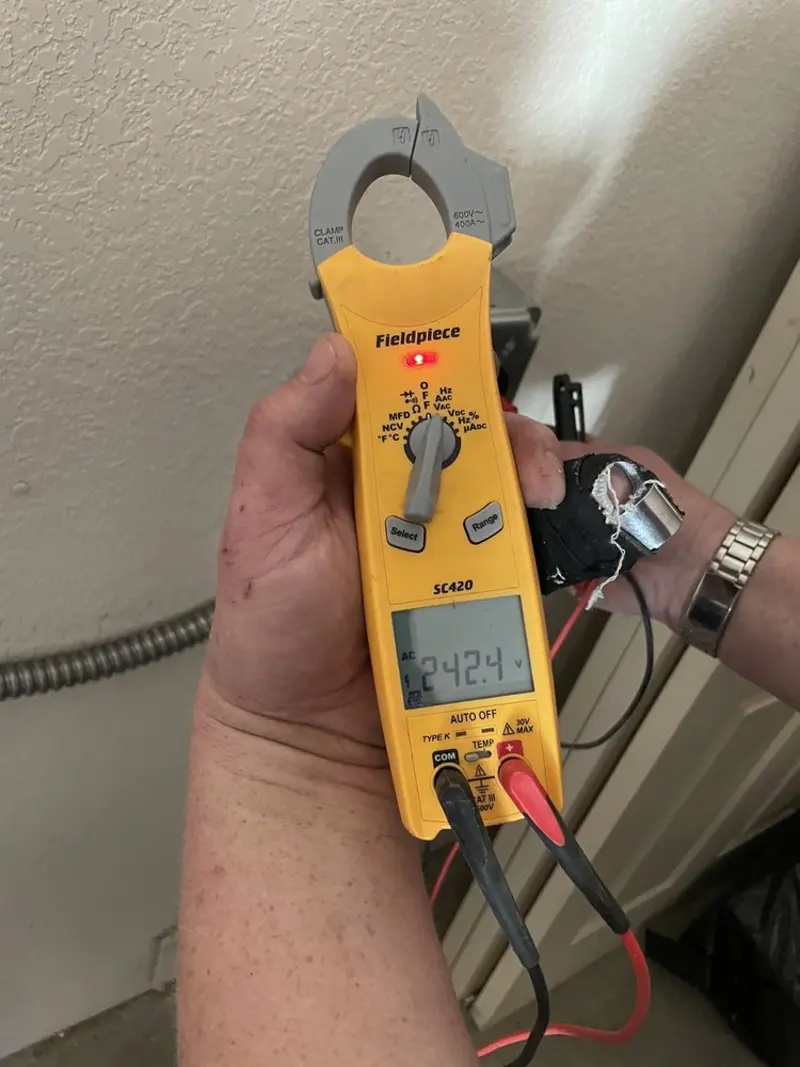 Voltage testing with clamp meter during Electrical Installation Services in Eastmont
